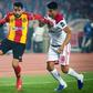 Ghailene Chaalali (L) of Esperance Tunis holds off Walid el Karti of Wydad Casablanca during the first leg of the 2019 CAF Champions League final in Rabat