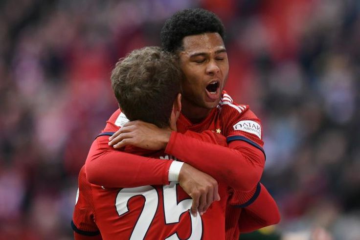 Bayern Munich forwards Thomas Mueller and Serge Gnabry celebrate