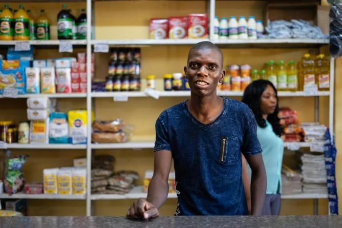 Grocery store owner Blessing Mushonga in his shop in Rimuka township, Kadoma. Life is getting harder for many Zimbabweans as the economic crisis worsens -- daily necessities are often in short supply