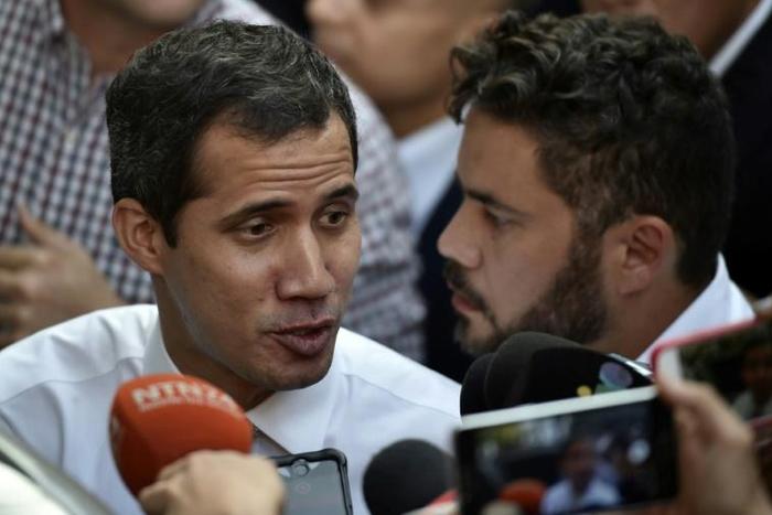 Lawmakers in Venezuela's Constituent Assembly authorised the high court to prosecute Guaido (pictured, L) for proclaiming himself the country's ruler