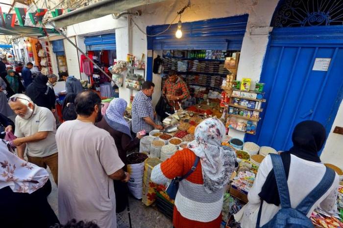 Libyans buy food products at a Tripoli market ahead of the start of the holy Muslim fasting month of Ramadan