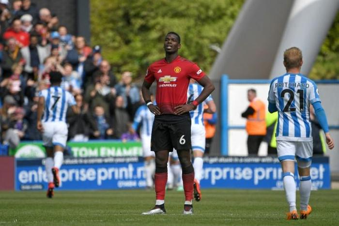 Stunned: Manchester United cannot now qualify for next season's Champions League after a 1-1 draw at relegated Huddersfield