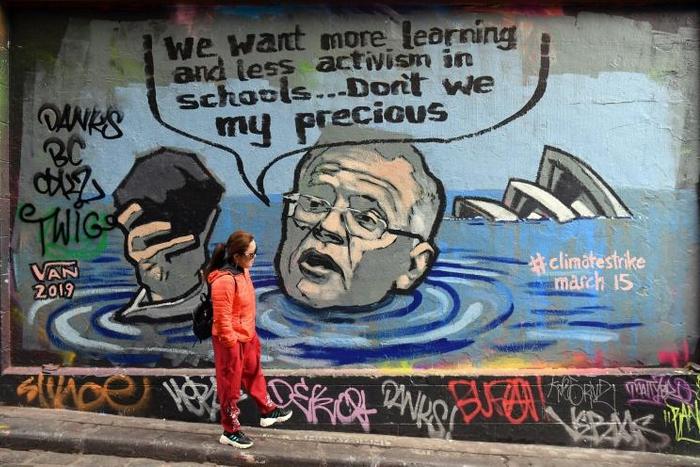 Mural in Melbourne shows Australian Prime Minister Scott Morrison holding a lump of coal as it advertises a rally by students around the world to protest climate change
