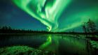 The Northern and Southern Lights are asymmetric dancers in the dark