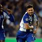 Porto's Brazilian defender Alex Telles (R) celebrates a goal with teammate Malian forward Moussa Marega during the UEFA Champions League round of 16 second leg football match between FC Porto and AS Roma at the Dragao stadium in Porto on March 6, 2019.