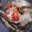 Rice, stew with fried fish and ice cubes