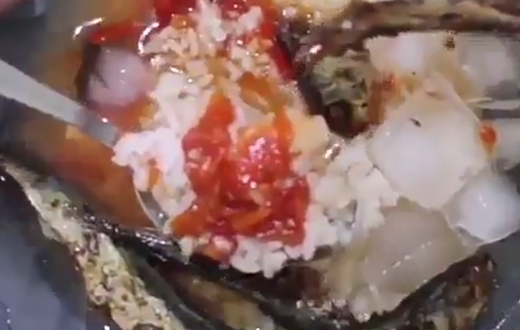Rice, stew with fried fish and ice cubes