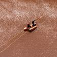 Cyprus forensic police officers probe the Red Lake out of the village of Mitsero, southwest of the capital Nicosia on April 30, 2019