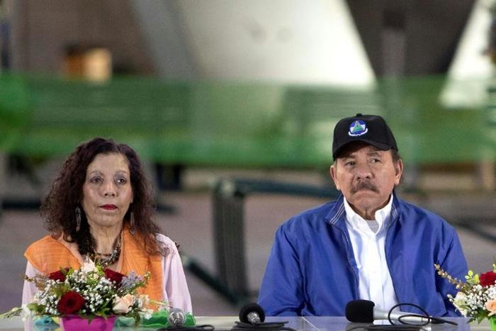 Nicaraguan President Daniel Ortega (R), pictured with his wife and Vice-President Rosario Murillo, ruled out a key opposition demand to bring forward elections