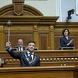 Ukraine's President Volodymyr Zelensky holds the Bulava, the Ukrainian symbol of power, during his inauguration ceremony at the parliament in Kiev on the same day that Russia wanted to convene a UN Security Council meeting on Ukraine's language law