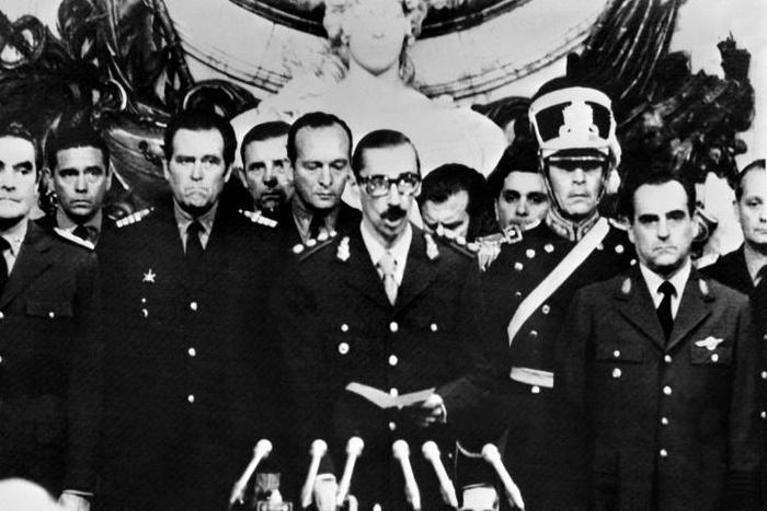 Lieutenant General Jorge Rafael Videla (center) takes an oath of office in 1976 after leading a coup in Argentina