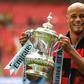 Manchester City's Belgian captain Vincent Kompany with the winner's trophy after the English FA Cup final football match between Manchester City and Watford at Wembley Stadium on Saturday