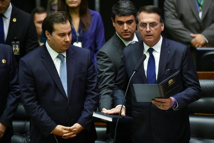 Rodrigo Maia (left) has urged President Jair Bolsonaro to get personally involved in the campaign finance scandal