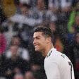 Cristiano Ronaldo looks on through drops of champagne after Juventus won an eighth straight Serie A title.