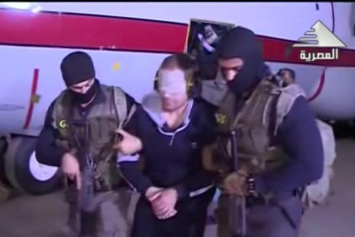 Egyptian state television broadcast footage of wanted jihadist Hisham Ashmawy being escorted off a plane in Cairo by intelligence agents