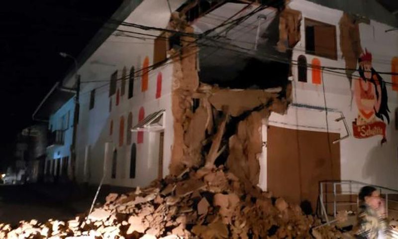Handout picture released by the Peruvian Fire Department showing a house damaged by an 8.0 earthquake in Yurimaguas, Peru, early on May 26