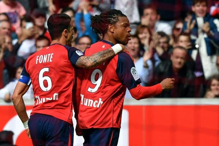 Loic Remy (R) celebrates his goal that should see Lille finish second in France