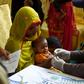 Pakistani paramedics have been taking blood samples for HIV testing in the city of Rato Dero