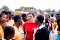 An Official of Coca-Cola chatting with some of the students