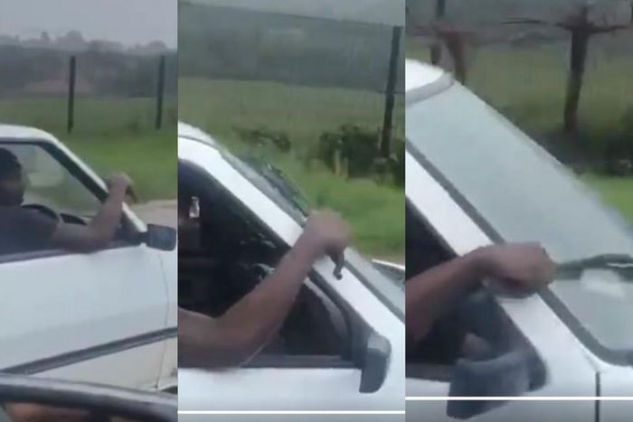 Rickety car driver uses his hand as manual wiper in heavy rain (Video)