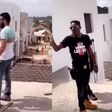 Shatta Wale strapped with a gun while inspecting his Kumasi mansion