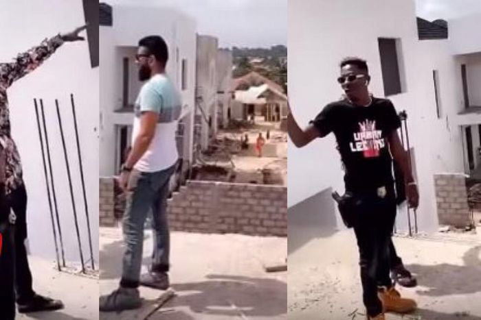 Shatta Wale strapped with a gun while inspecting his Kumasi mansion