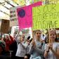 Students hold up placards during an environmental protest in Melbourne on May 3, 2019