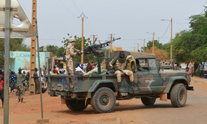 Malian soldiers on patrol in the city of Gao after a deadly suicide car bomb detonated in November 2018