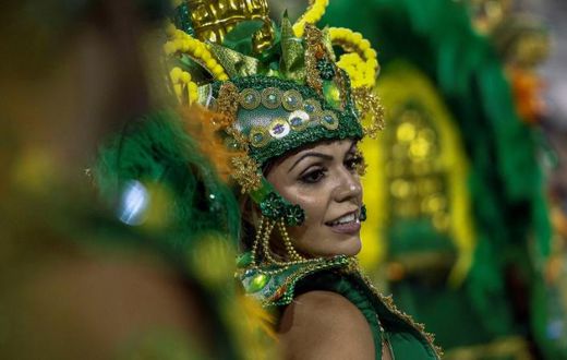 A reveller of "Unidos de Vila Maria" samba school performs during the second night of carnival in Sao Paulo