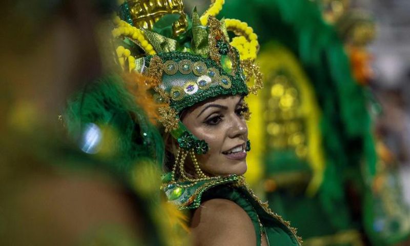 A reveller of "Unidos de Vila Maria" samba school performs during the second night of carnival in Sao Paulo