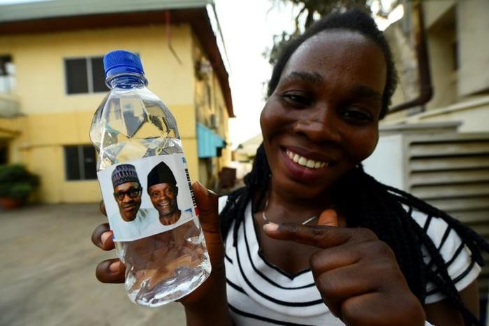 Water works? Bottled water bearing the image of Nigeria's President Mohammadu Buhari and his vice president ahead of Saturday's rescheduled elections