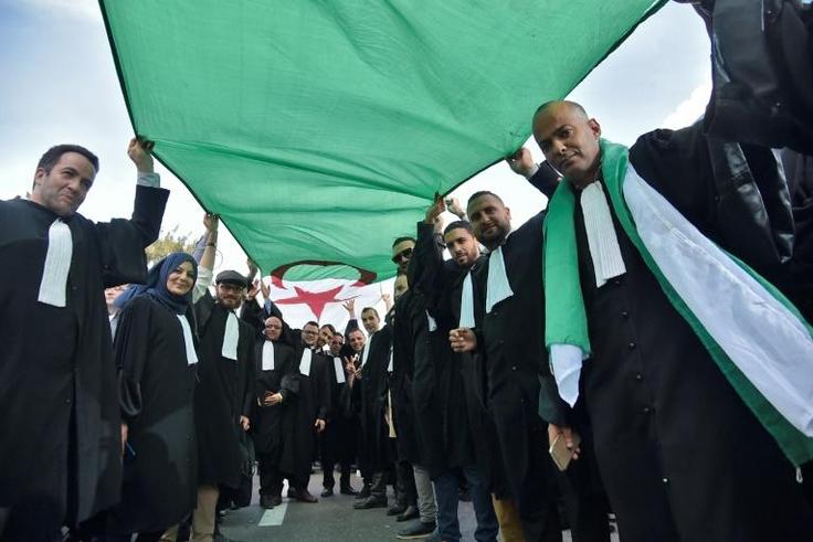 Algerian lawyers and journalists take part in a protest against their ailing president's bid for a fifth term in power, in Algiers