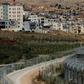 The village of Majdal Shams (L)in the Golan Heights, an area that US refers to as "Israeli-controlled" rather than "Israeli-occupied" in its latest annual human rights report