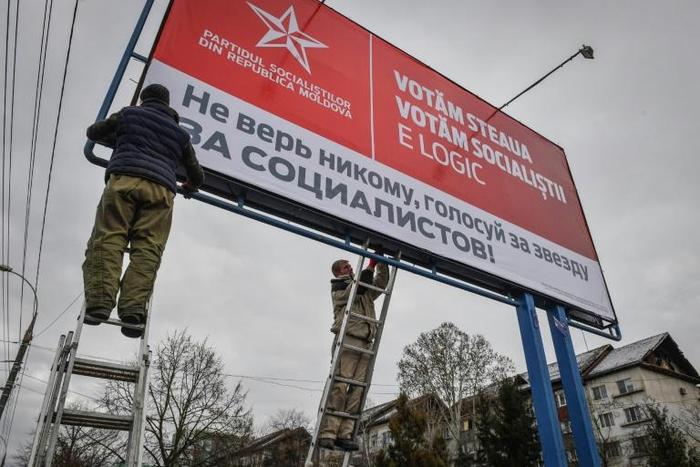 Sunday's vote is shaping up as a three-way race between the pro-Russian Socialist party of President Igor Dodon, whose posters are seen here, the ruling Democratic party and a pro-European alliance