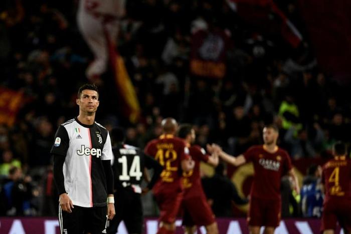 Cristiano Ronaldo had a goal ruled out for offside as Roma inflicted a third defeat this season on the champions.