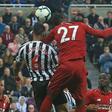 Divock Origi heads the winner against Newcastle to lift Liverpool back to the top of the Premier League
