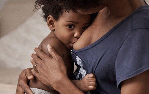 A mother breastfeeding her child