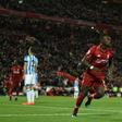 Liverpool's Sadio Mane celebrates scoring in the rout of Huddersfield