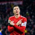 Robert Lewandowski celebrates scoring his 100th goal at the Allianz Arena in Bayern colours