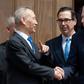 Chinese Vice Premier Liu He (L) shakes hands with US Trade Representative Robert Lighthizer (R) alongside US Treasury Secretary Steven Mnuchin (C) following two hours of negotiations