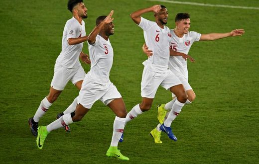 Qatar players celebrate scoring in their Asian Cup final win over Japan