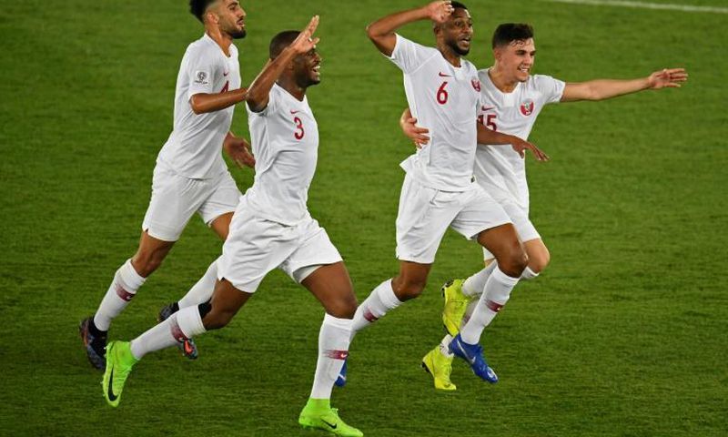 Qatar players celebrate scoring in their Asian Cup final win over Japan