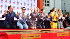 The cast of "The Big Bang Theory" press their handprints into the cement at the TCL Chinese Theatre