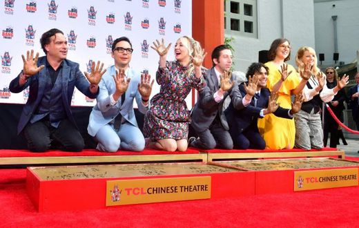 The cast of "The Big Bang Theory" press their handprints into the cement at the TCL Chinese Theatre