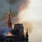 The Notre Dame spire succumbs to the flames on April 15