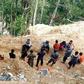 The rescue effort at the remote site on Indonesia's Sulawesi island has been hampered by steep terrain and unstable soil conditions