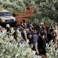 Syrian rebels gather in a field in the northern countryside of Hama province during clashes with regime forces