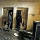 A fighter from the Syrian Democratic Forces (SDF) walks inside a former Islamic State (IS) group prison in the city of Hajin, the last remaining IS pocket in Syria