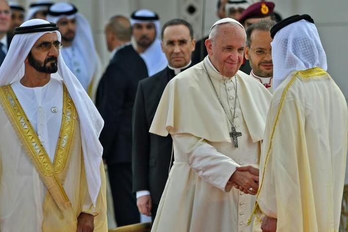 Dubai ruler Sheikh Mohammed bin Rashid Al-Maktoum accompanies Pope Francis as he meets dignitaries during a welcome ceremony in Abu Dhabi on February 4, 2019