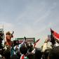 Sudanese protesters chant slogans during a rally outside the army complex in Sudan's capital Khartoum on April 20, 2019